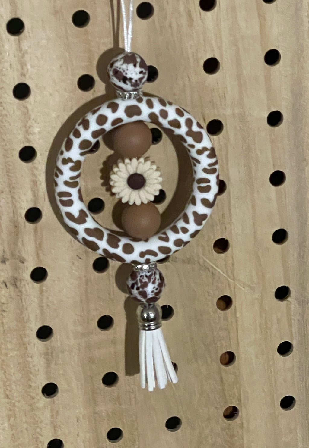 Brown and white cow print car charm