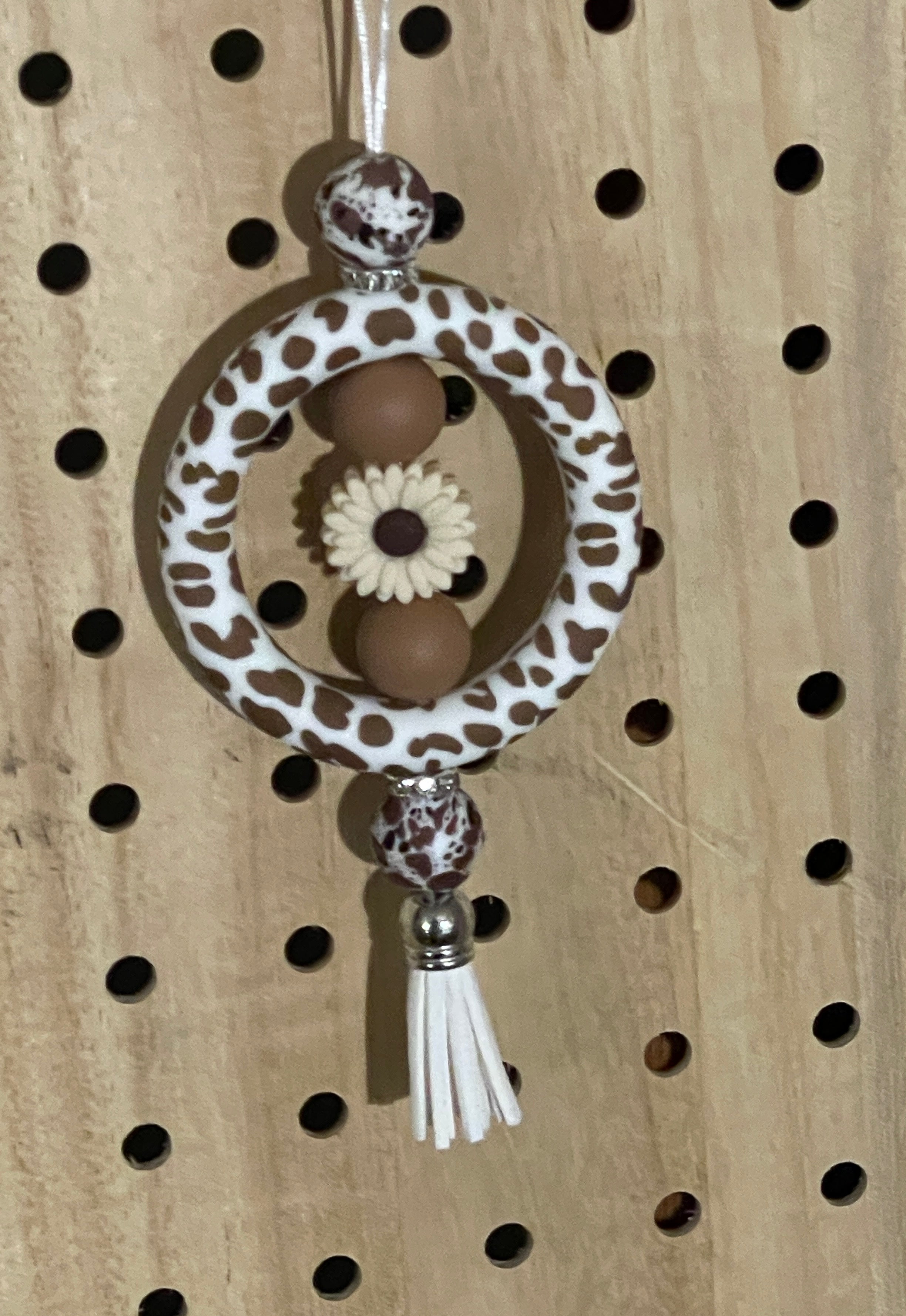 Brown and white cow print car charm